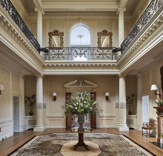 The venue's grand entrance hall with a floral centrepiece